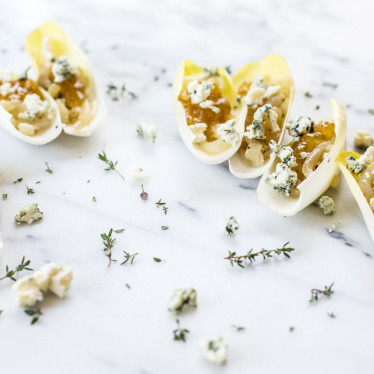 Endive Bites with Buttermilk Blue, Caramelized Onions and Fig Jam