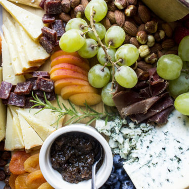 Cheese board with fruit and nuts