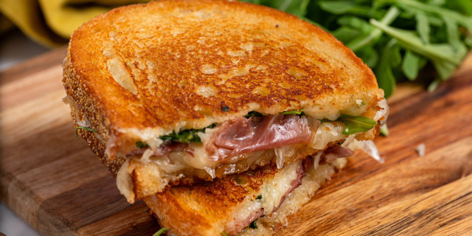 Grilled Cheese with Grand Cru, Fig Jam, Prosciutto and Arugula - Roth Cheese